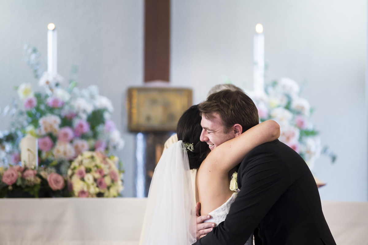 Hug after kiss bride and groom 